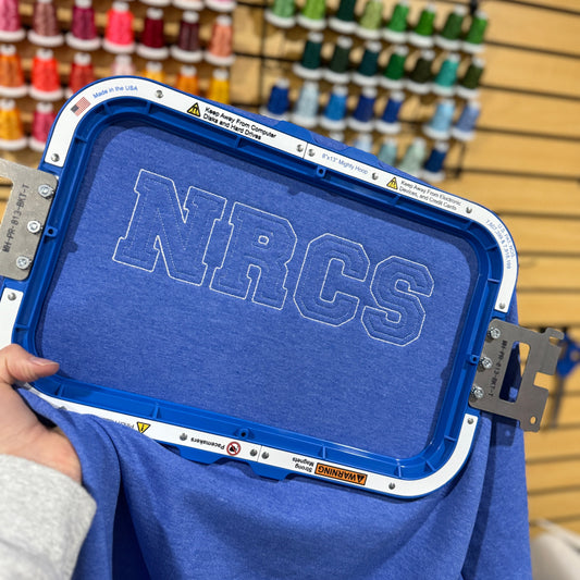 Blue shirt with 'NRCS'