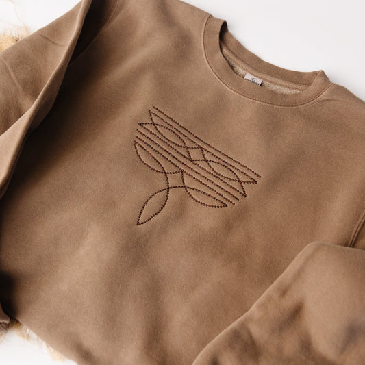 Brown sweatshirt with a western design on a white background