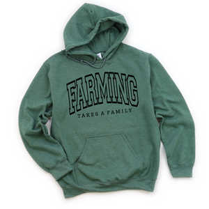 Green hooded sweatshirt with the text 'FARMING TAKES A FAMILY' printed on the front.