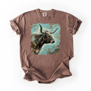 Brown t-shirt with a graphic of a cow on a white background