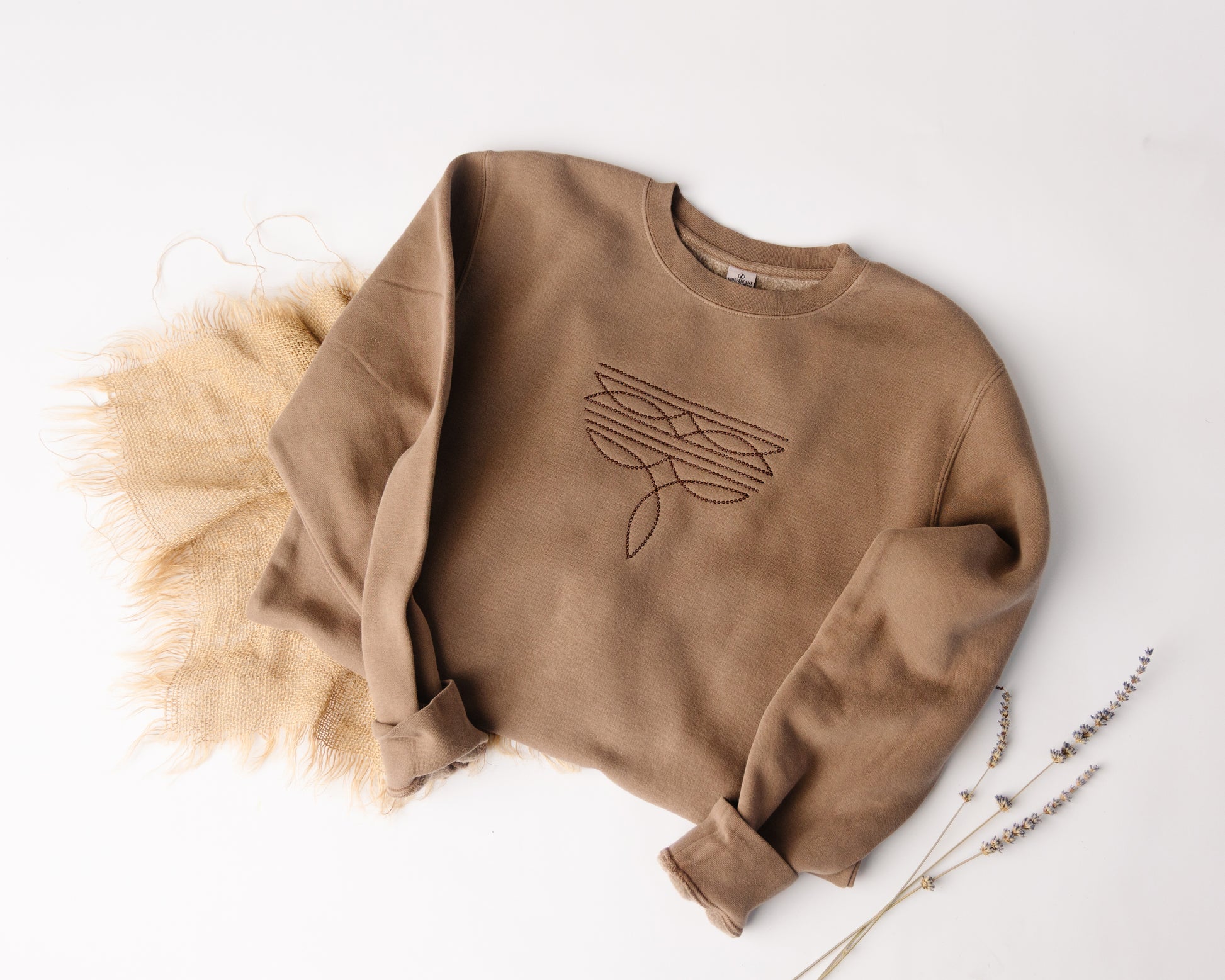 Brown sweatshirt with a boot stitch design on a white background