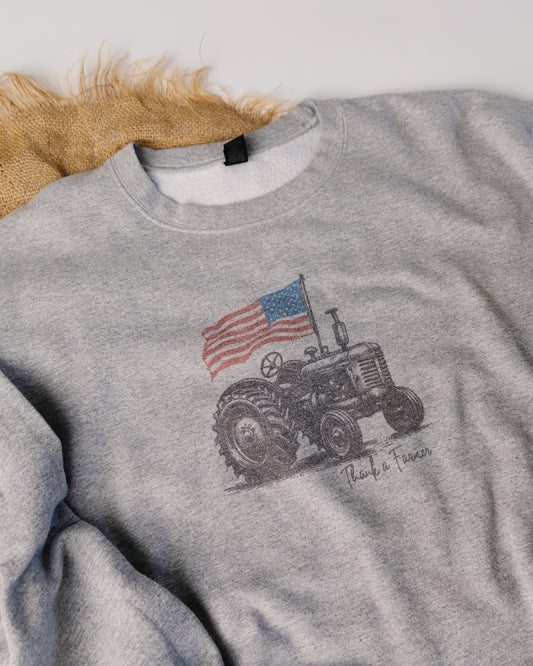 Gray sweatshirt with a graphic design on a light background