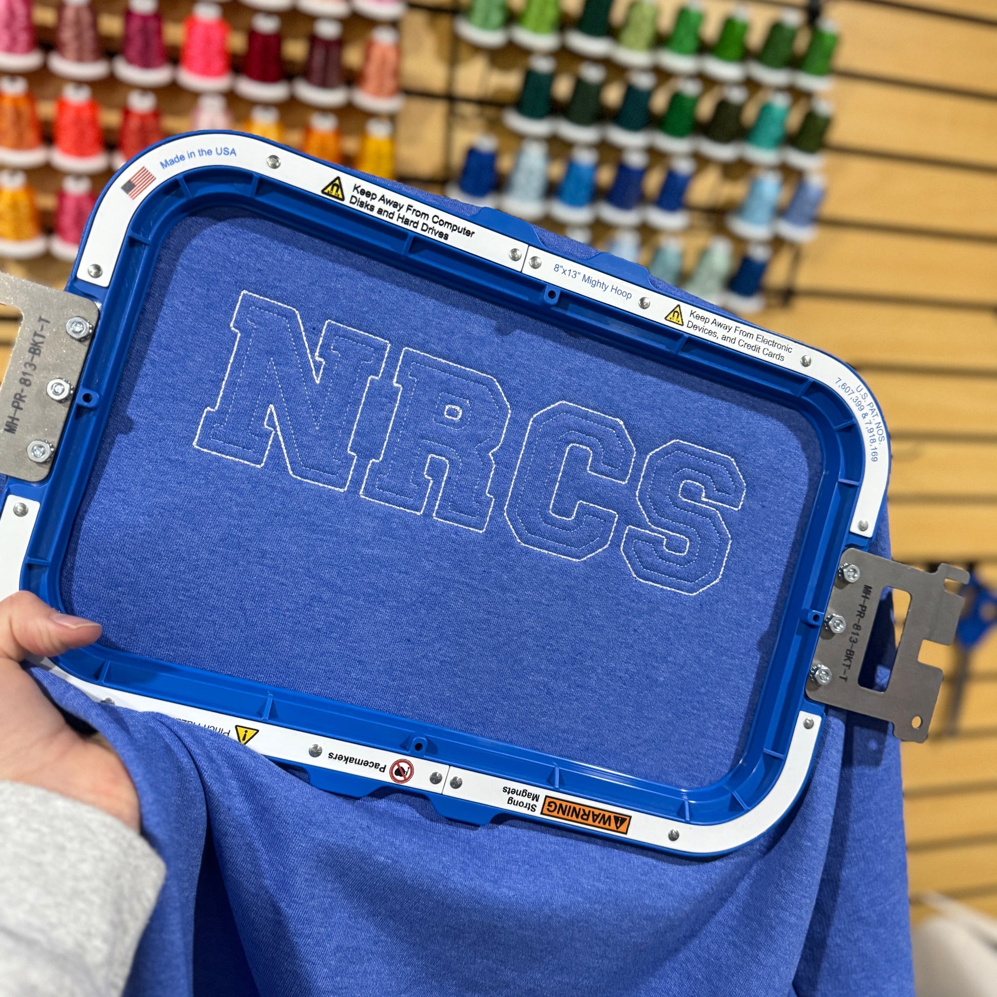Blue shirt with 'NRCS'