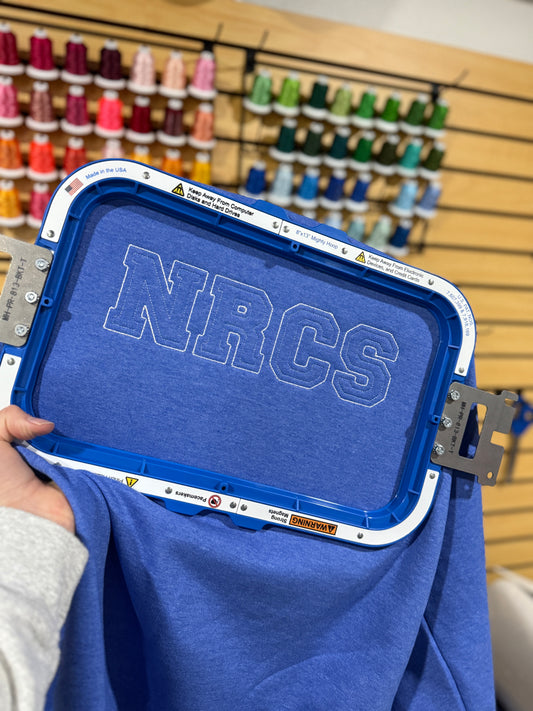 Blue shirt with 'NRCS'