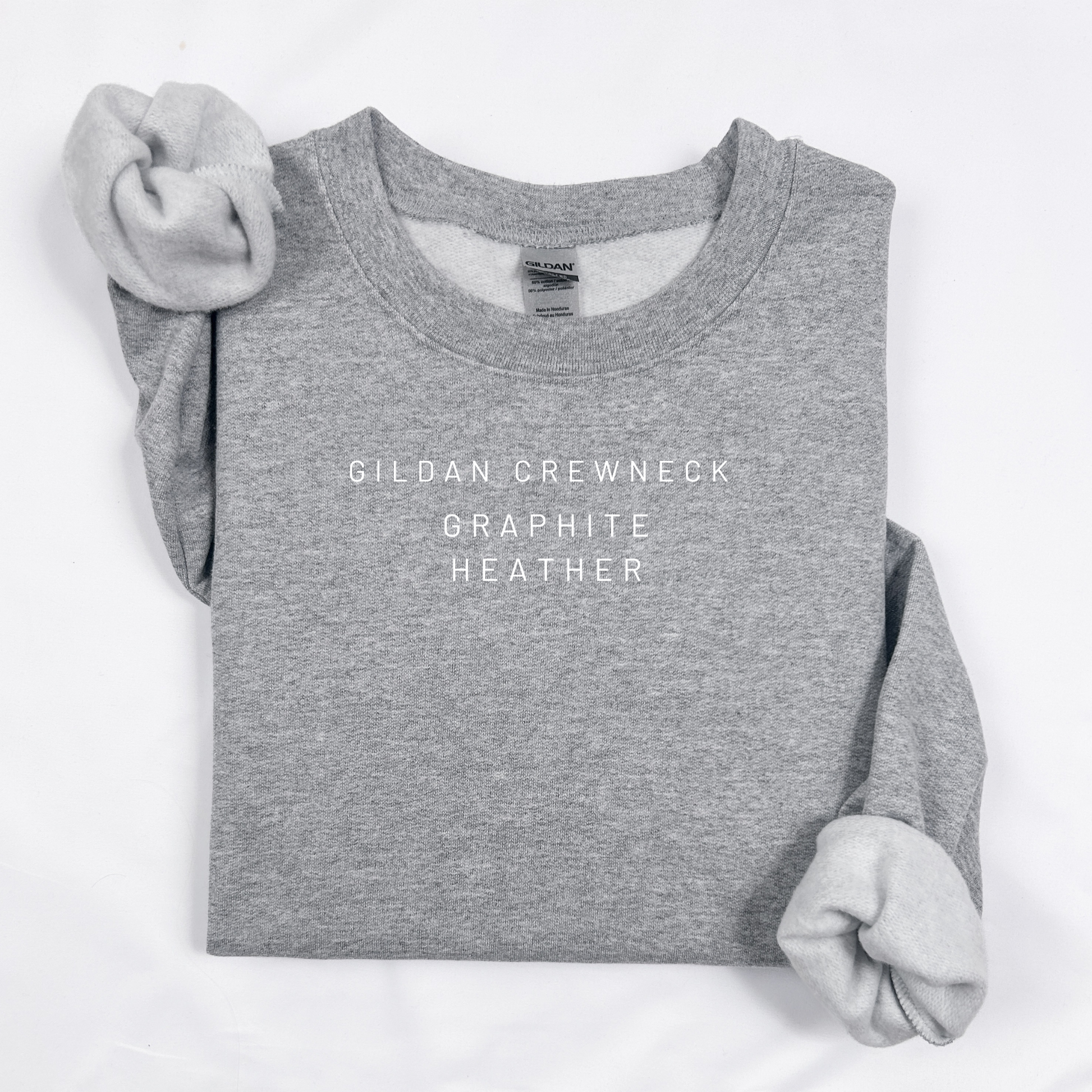 Gray sweatshirt with 'Gildan Crewneck Graphite Heather' text on a white background
