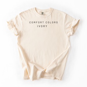 Beige t-shirt labeled 'Comfort Colors Ivory' on a white background