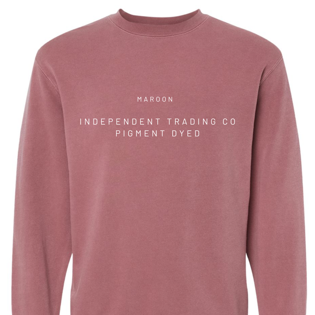 Maroon long-sleeve shirt with white text on a white background